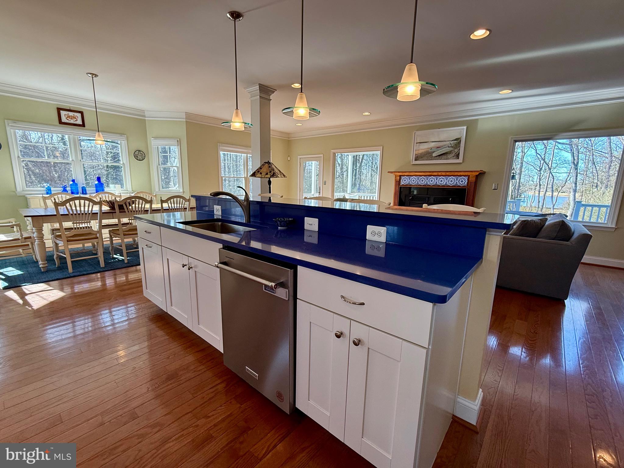 48830 Curleys Road Ridge, MD 20680 - Photo 17 of 65 a kitchen with stainless steel appliances granite countertop wooden floors sink and cabinets
