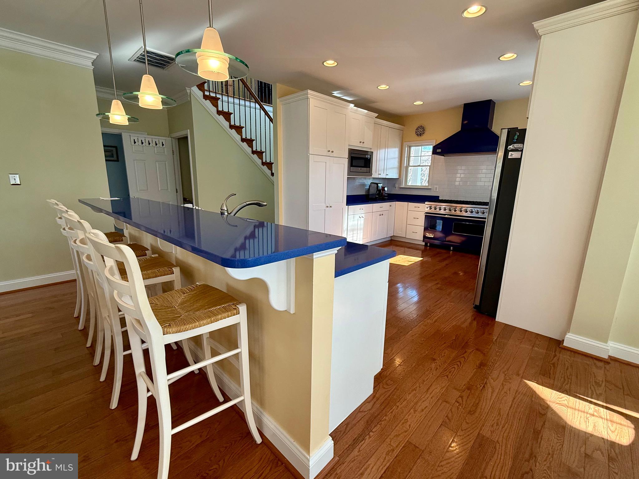 48830 Curleys Road Ridge, MD 20680 - Photo 20 of 65 a view of kitchen and dining room with wooden floor