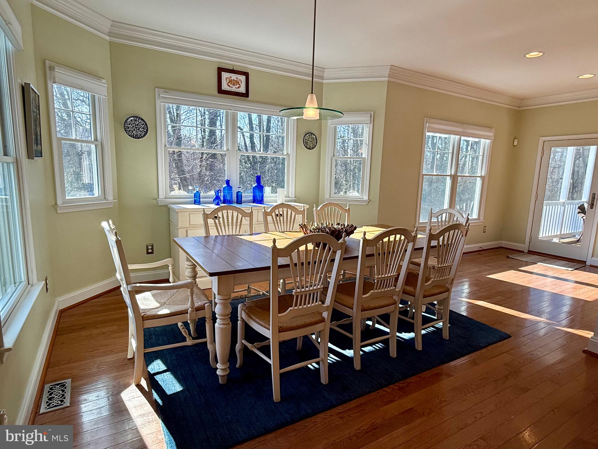 48830 Curleys Road Ridge, MD 20680 - Photo 25 of 65 a view of a dining room with furniture window and wooden floor