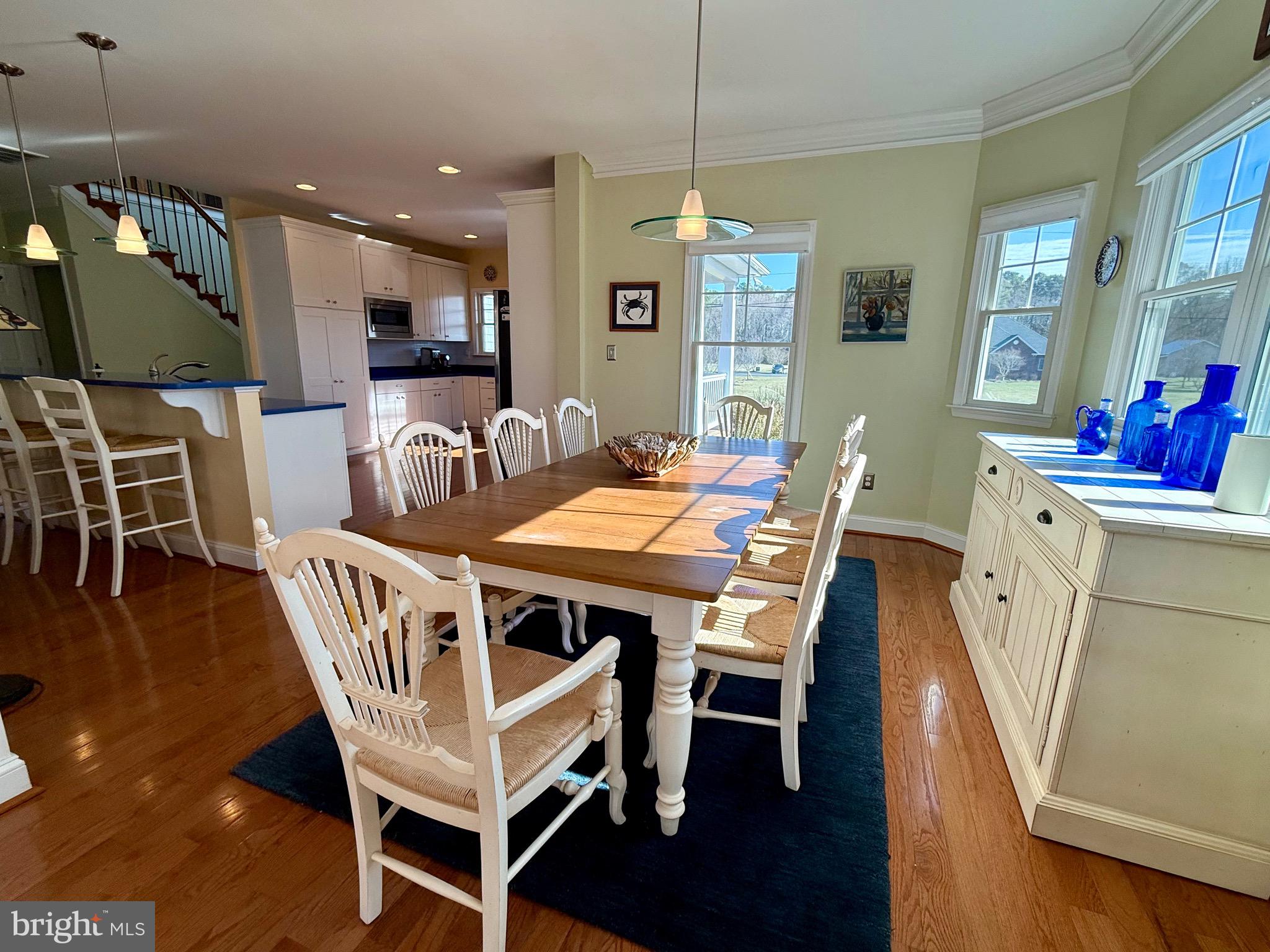 48830 Curleys Road Ridge, MD 20680 - Photo 26 of 65 a dining room with furniture a rug and wooden floor