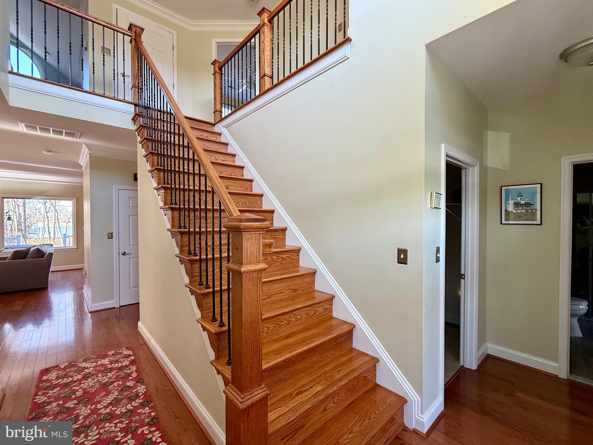 48830 Curleys Road Ridge, MD 20680 - Photo 34 of 65 a view of entryway and hall with wooden floor
