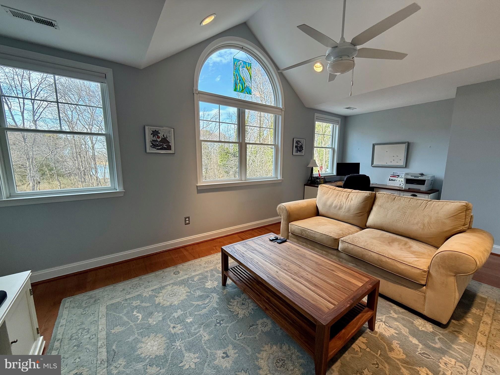 48830 Curleys Road Ridge, MD 20680 - Photo 37 of 65 a living room with furniture a chandelier and a window