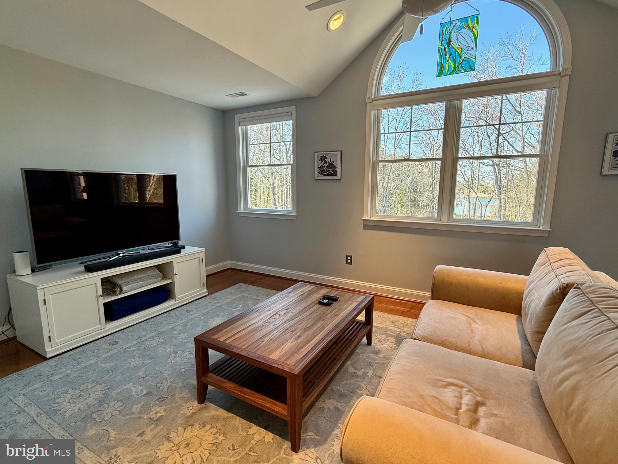 48830 Curleys Road Ridge, MD 20680 - Photo 38 of 65 a living room with furniture and a flat screen tv