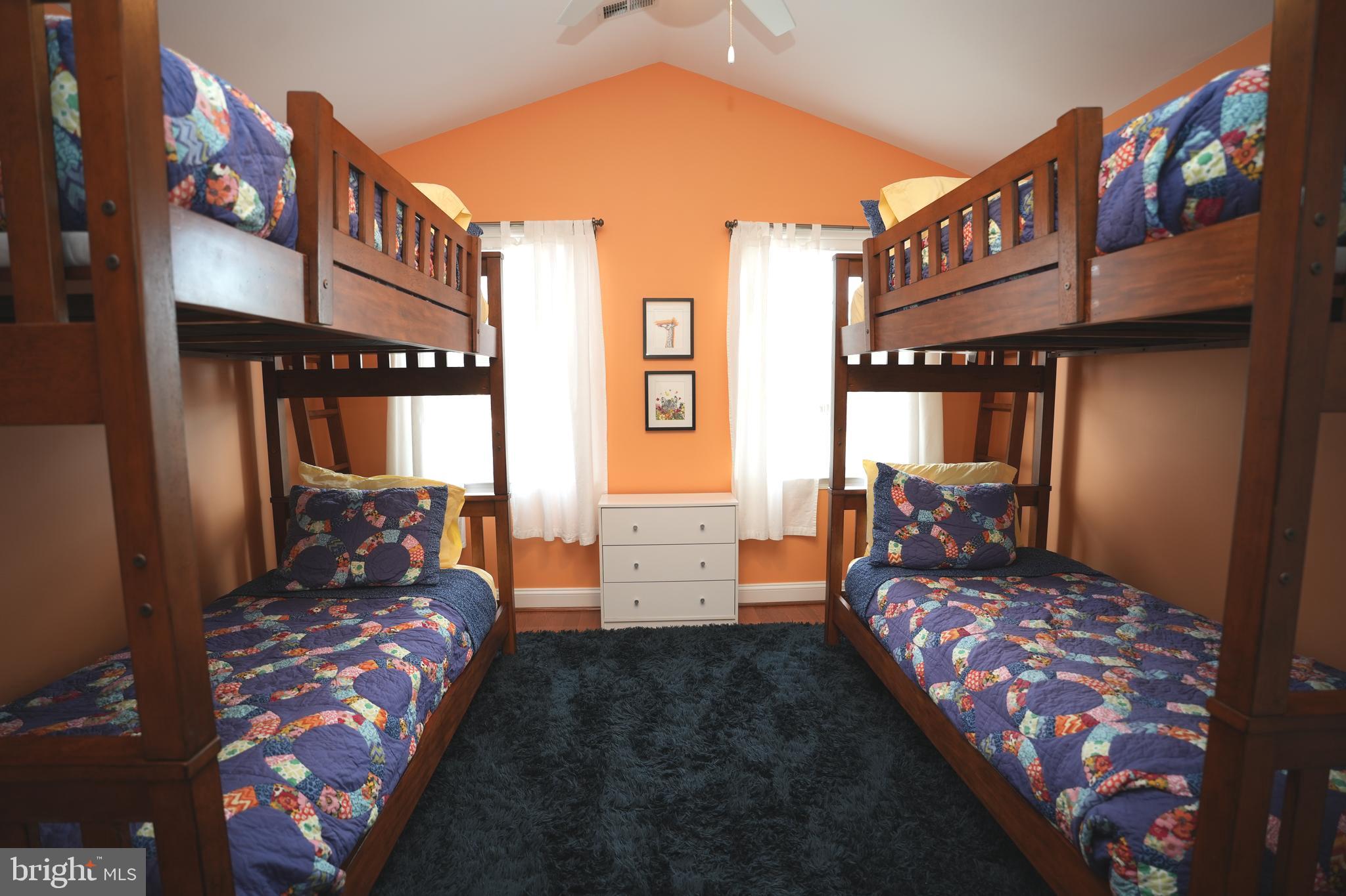48830 Curleys Road Ridge, MD 20680 - Photo 43 of 65 a bedroom with furniture and a large window