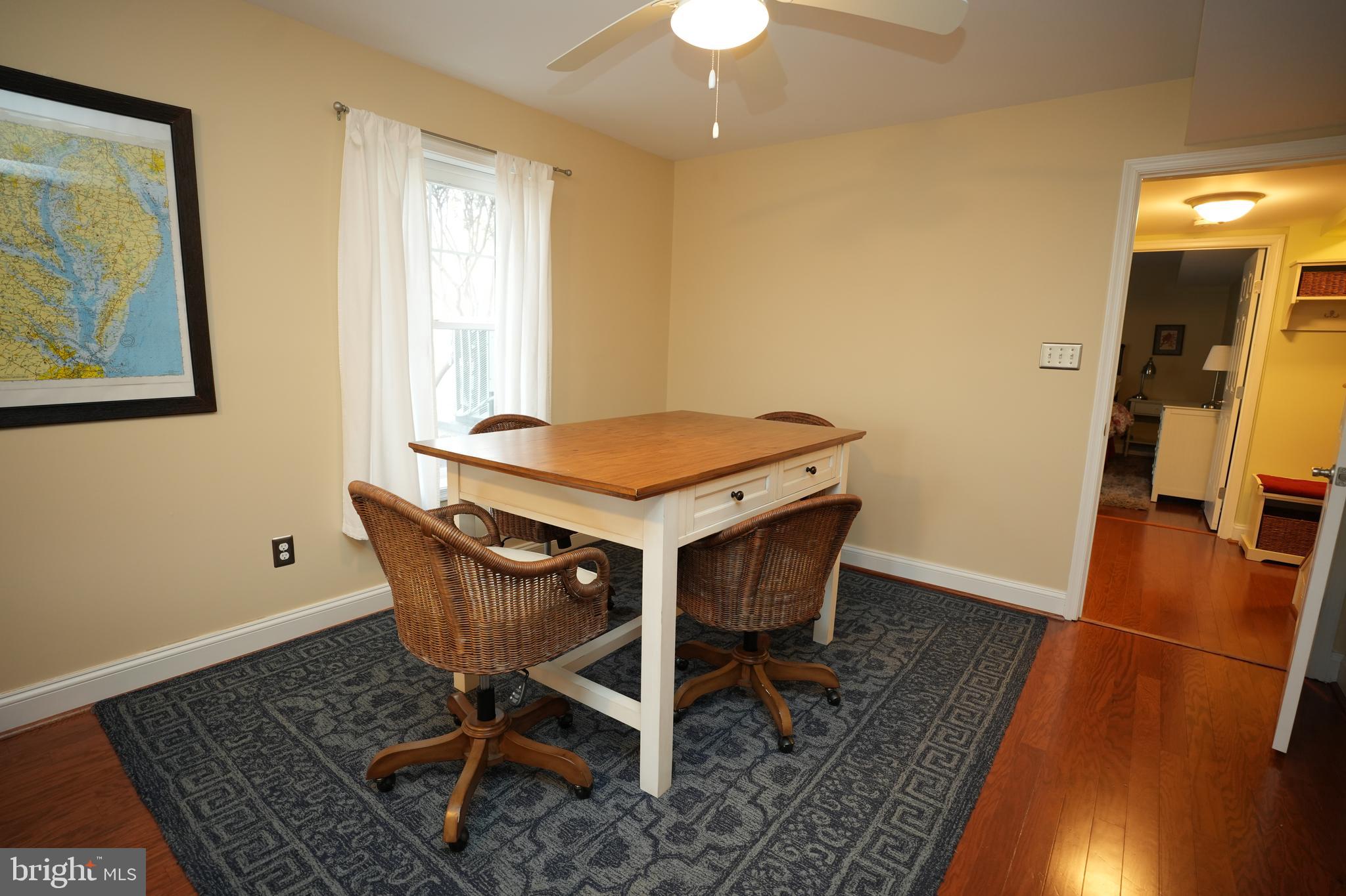 48830 Curleys Road Ridge, MD 20680 - Photo 48 of 65 a view of a dining room with furniture and wooden floor