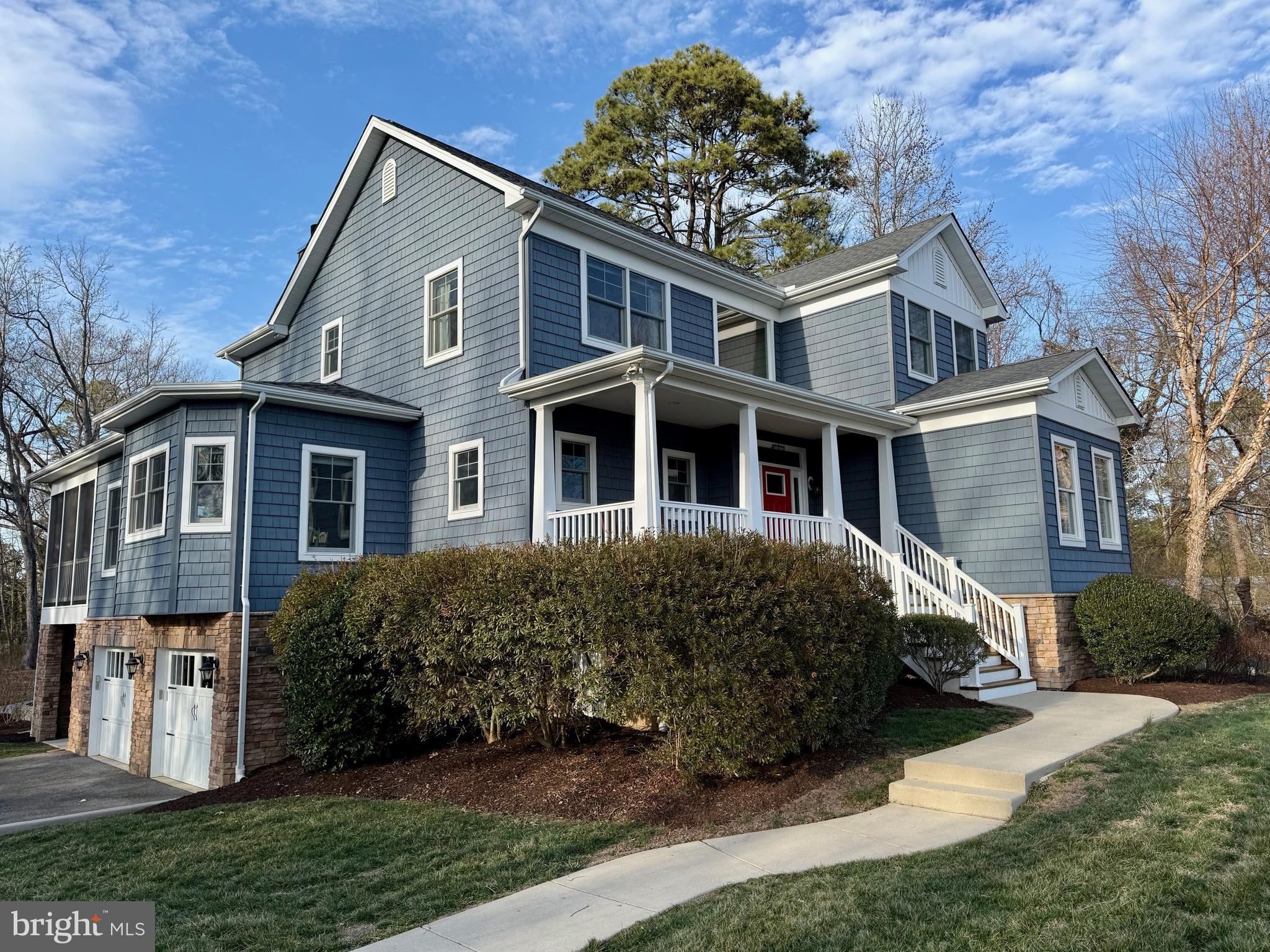 48830 Curleys Road Ridge, MD 20680 - Photo 57 of 65 a front view of a house with a garden