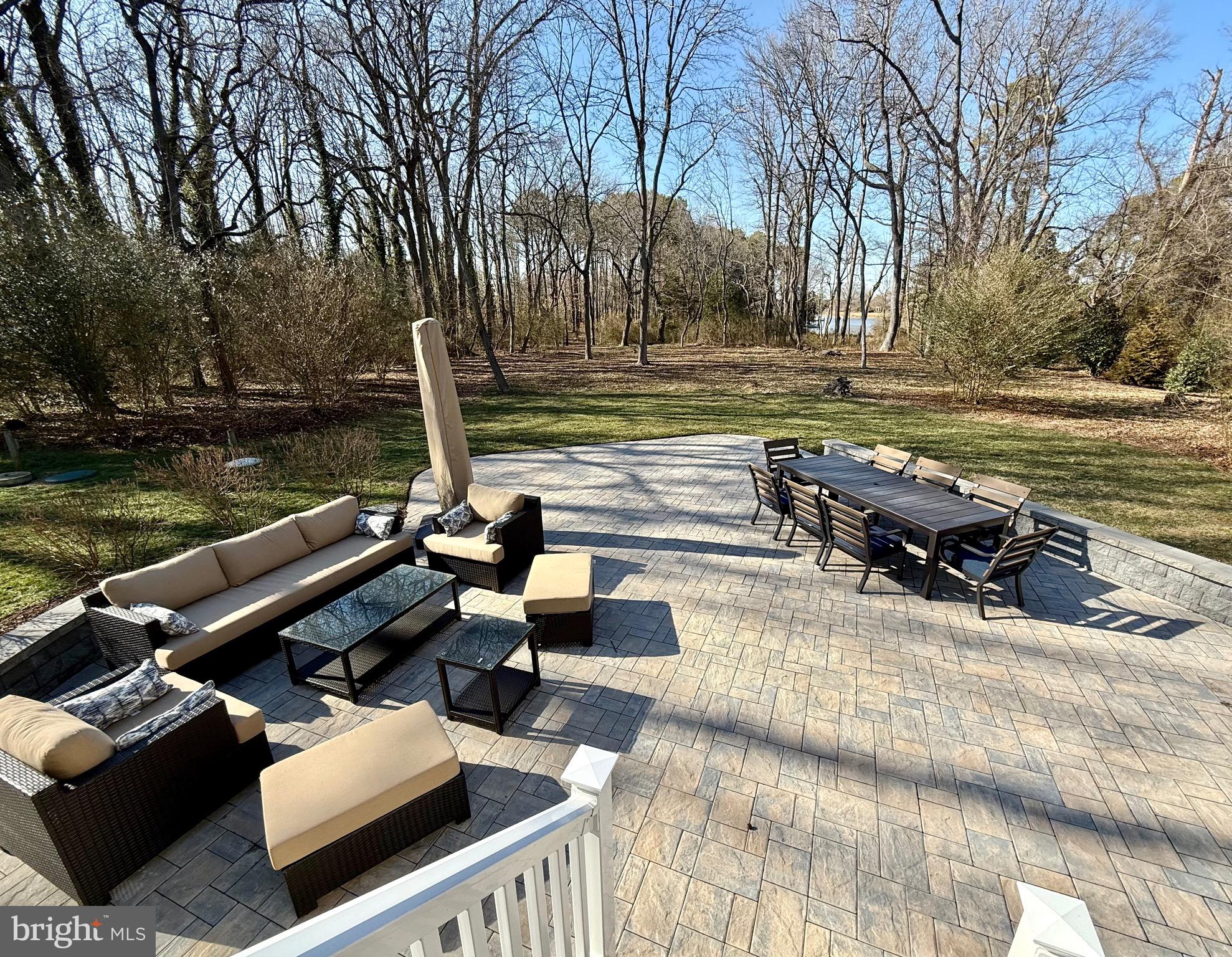 48830 Curleys Road Ridge, MD 20680 - Photo 62 of 65 a view of a patio with chairs and a table