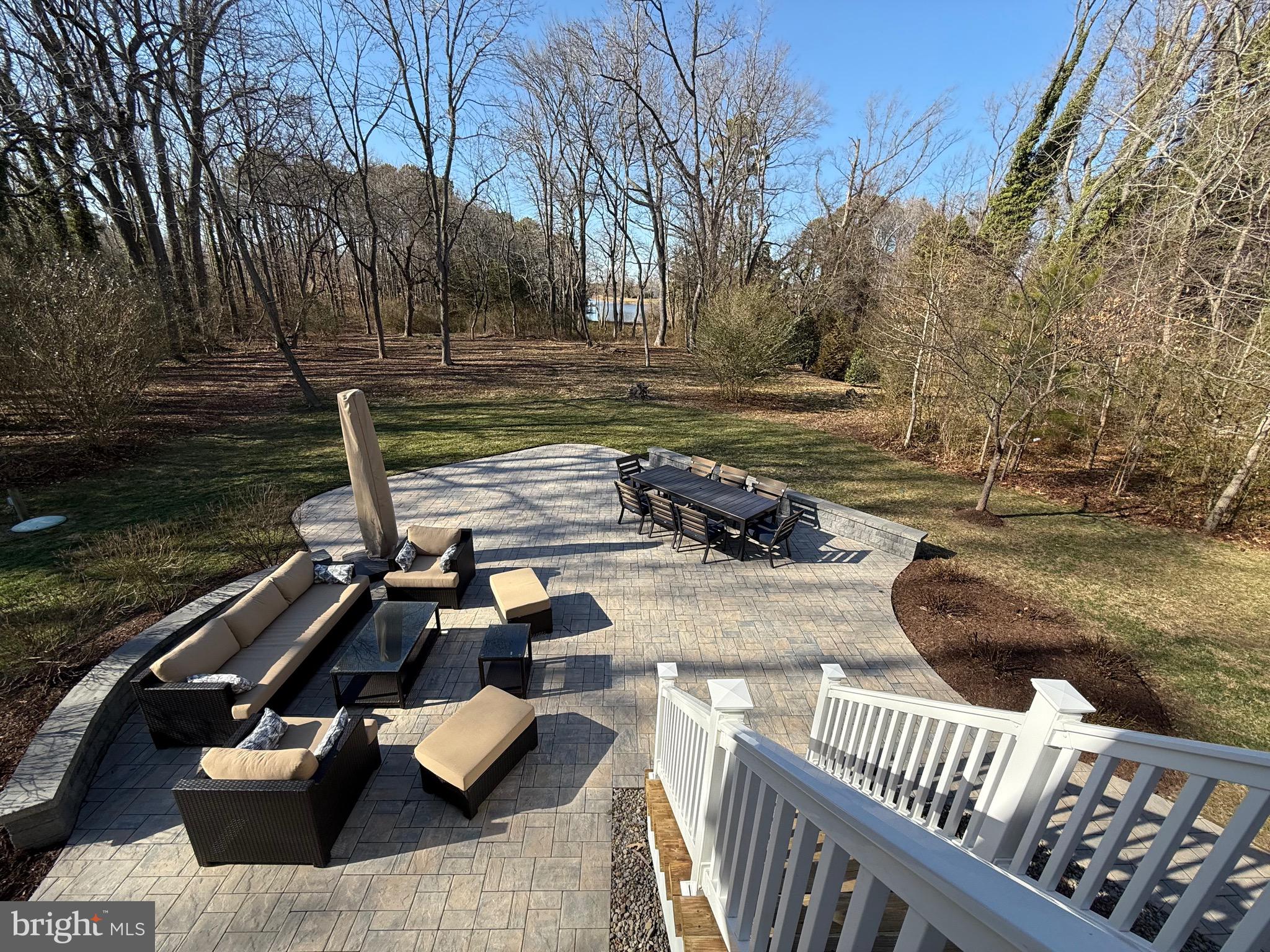 48830 Curleys Road Ridge, MD 20680 - Photo 65 of 65 a view of a wooden deck with chairs and wooden fence