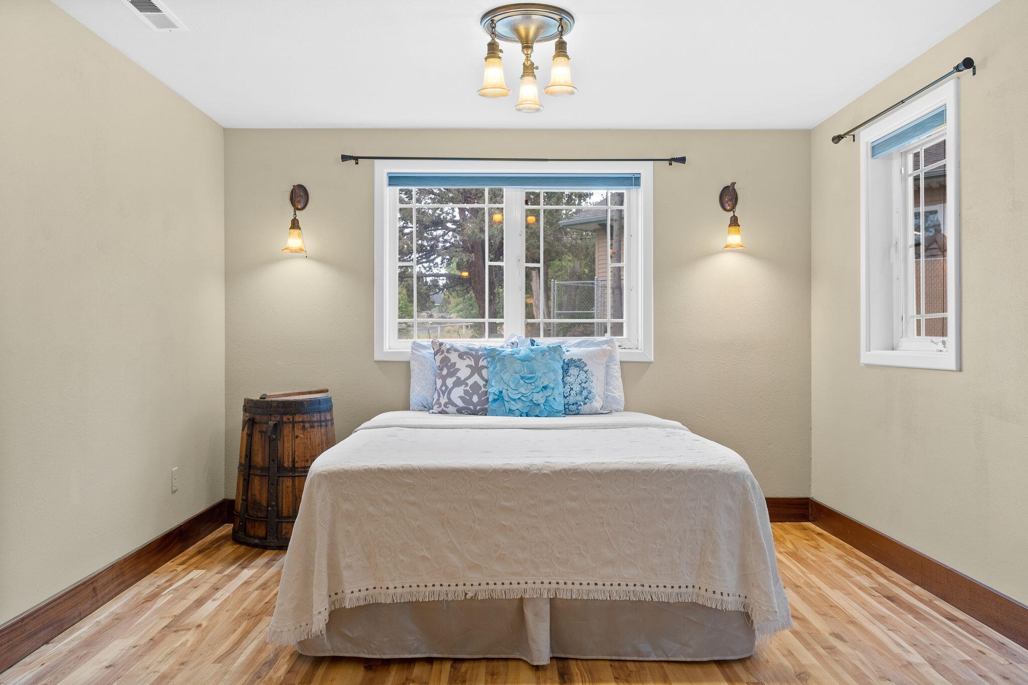 21925 Bear Creek Road Bend, OR 97702 - Photo 42 of 104 a large bed sitting in a bedroom next to a window