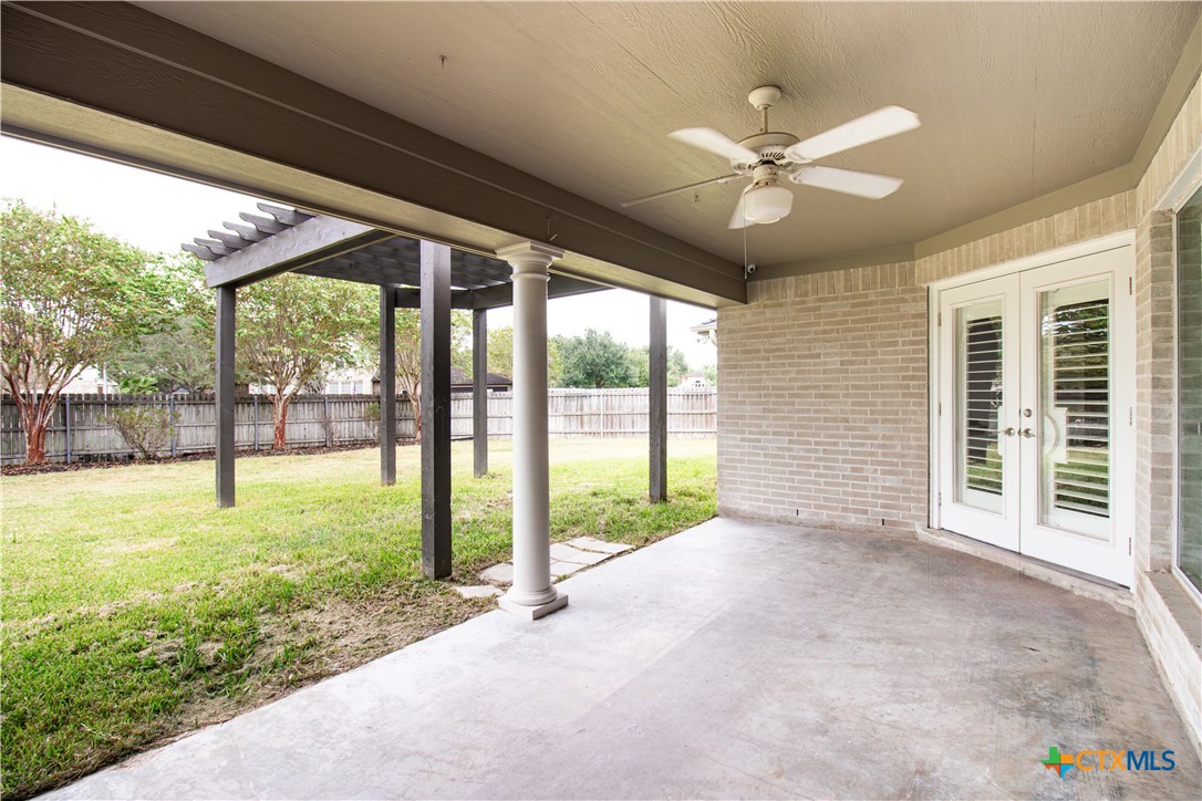 202 Ridge View Victoria, TX 77904 - Photo 3 of 37 a view of a porch with a ceiling fan and a large window