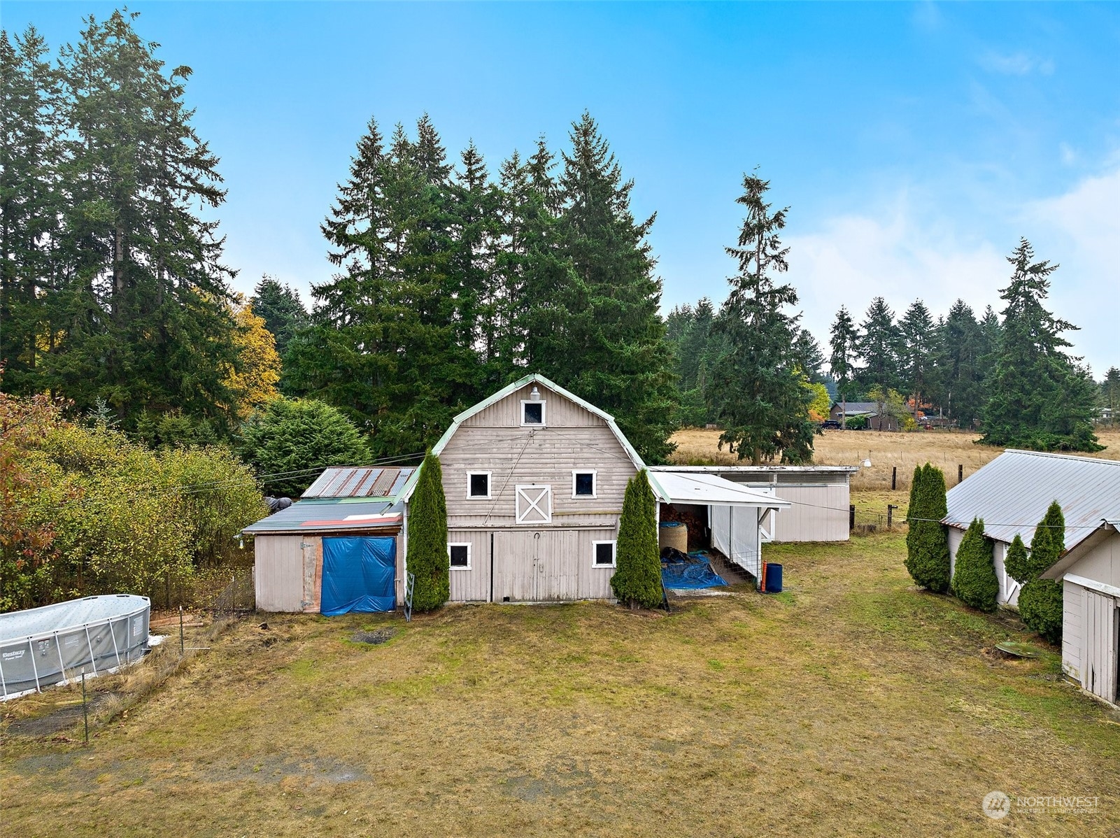 7639 191st Avenue Southwest Rochester, WA 98579 - Photo 37 of 40 a large house with a big yard and large trees