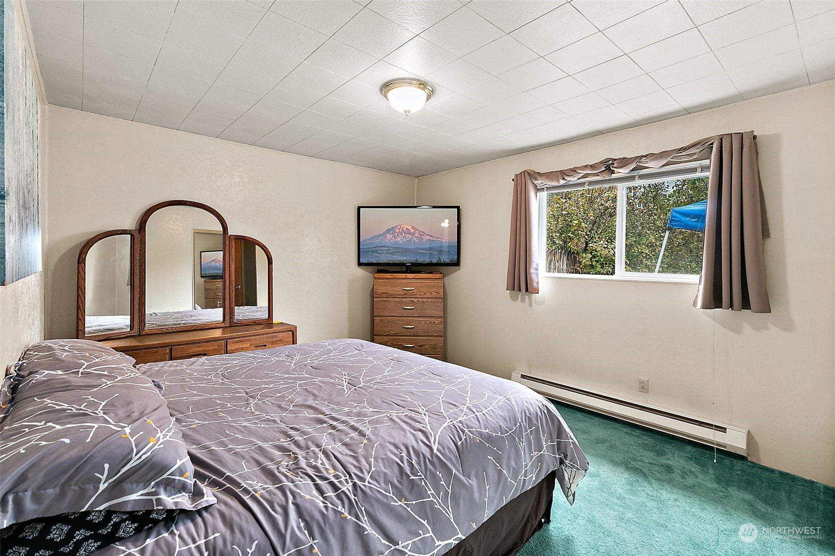 7639 191st Avenue Southwest Rochester, WA 98579 - Photo 8 of 40 a bedroom with a bed and a large window