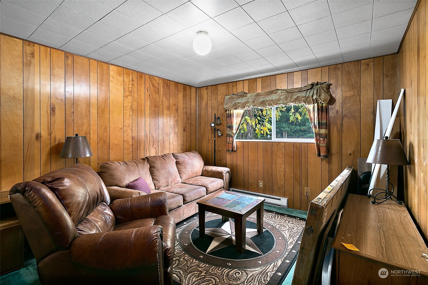 7639 191st Avenue Southwest Rochester, WA 98579 - Photo 10 of 40 a living room with furniture a large window