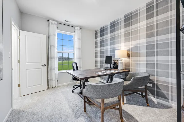 a workspace with furniture and a bookshelf