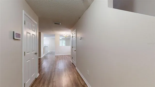 a view of gallery with wooden floor