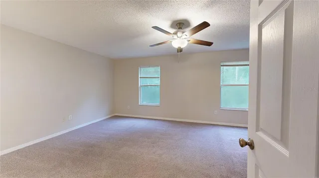 a view of empty room with windows