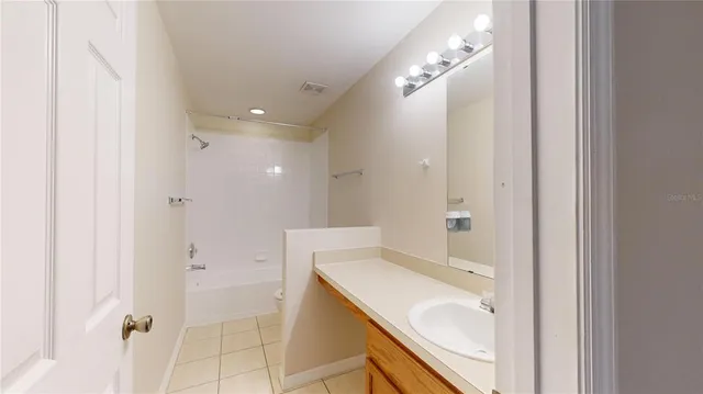 a bathroom with a sink double vanity and a mirror