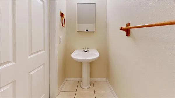 a bathroom with a sink and mirror