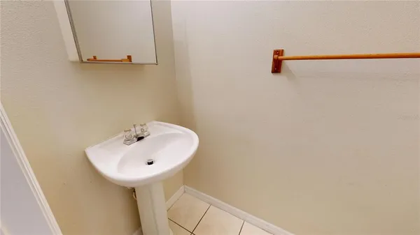 a bathroom with a sink and mirror