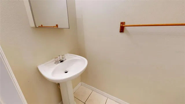 a bathroom with a sink and mirror