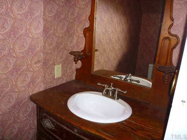2531 Benson Hardee Road Benson, NC 27504 - Photo 19 of 25 Half bath in the foyer.