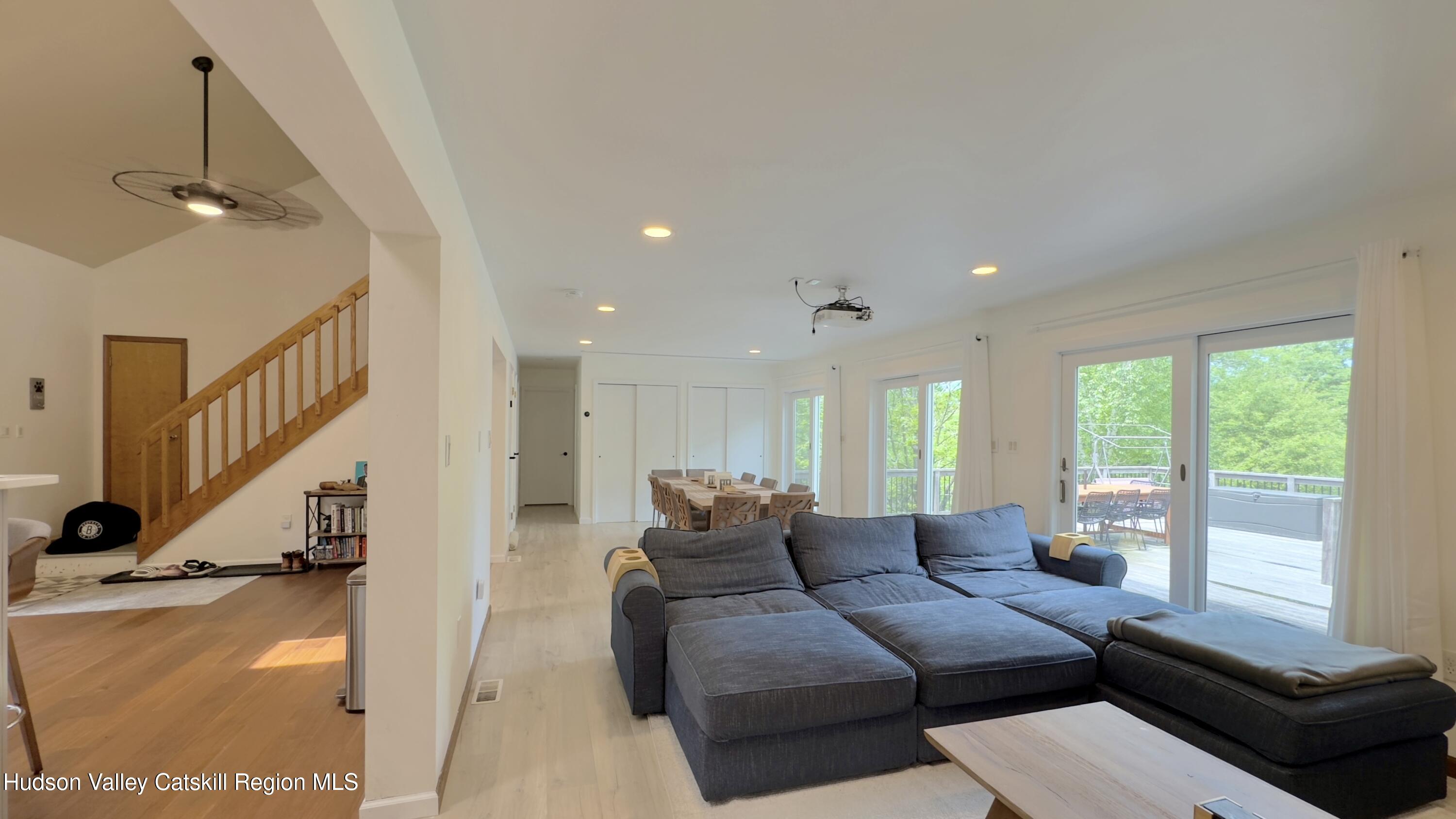 3223 Sleepy Hollow Road Athens, NY 12015 - Photo 17 of 73 a living room with furniture and a large window