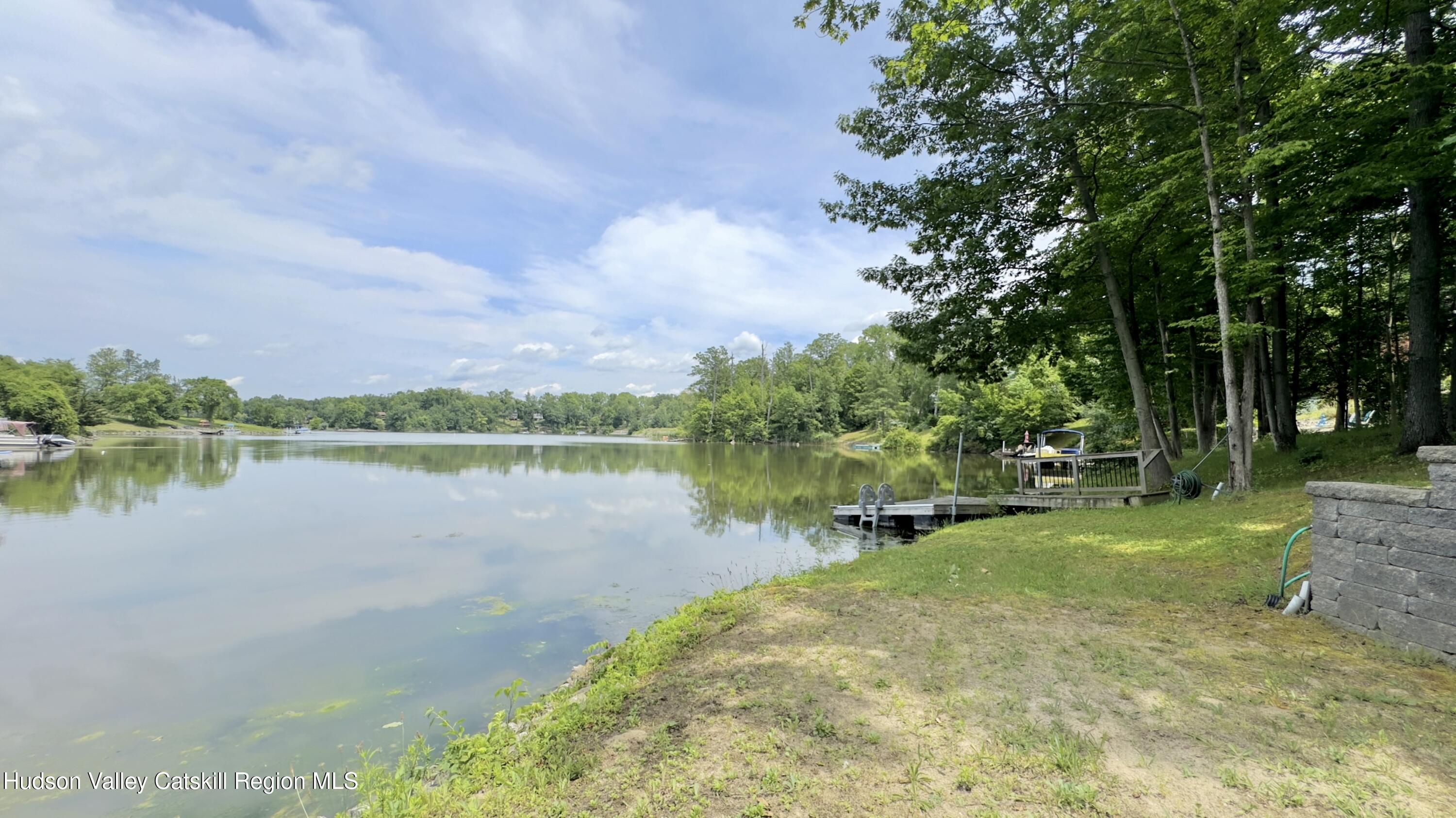 3223 Sleepy Hollow Road Athens, NY 12015 - Photo 2 of 73 a view of a lake with houses in the back