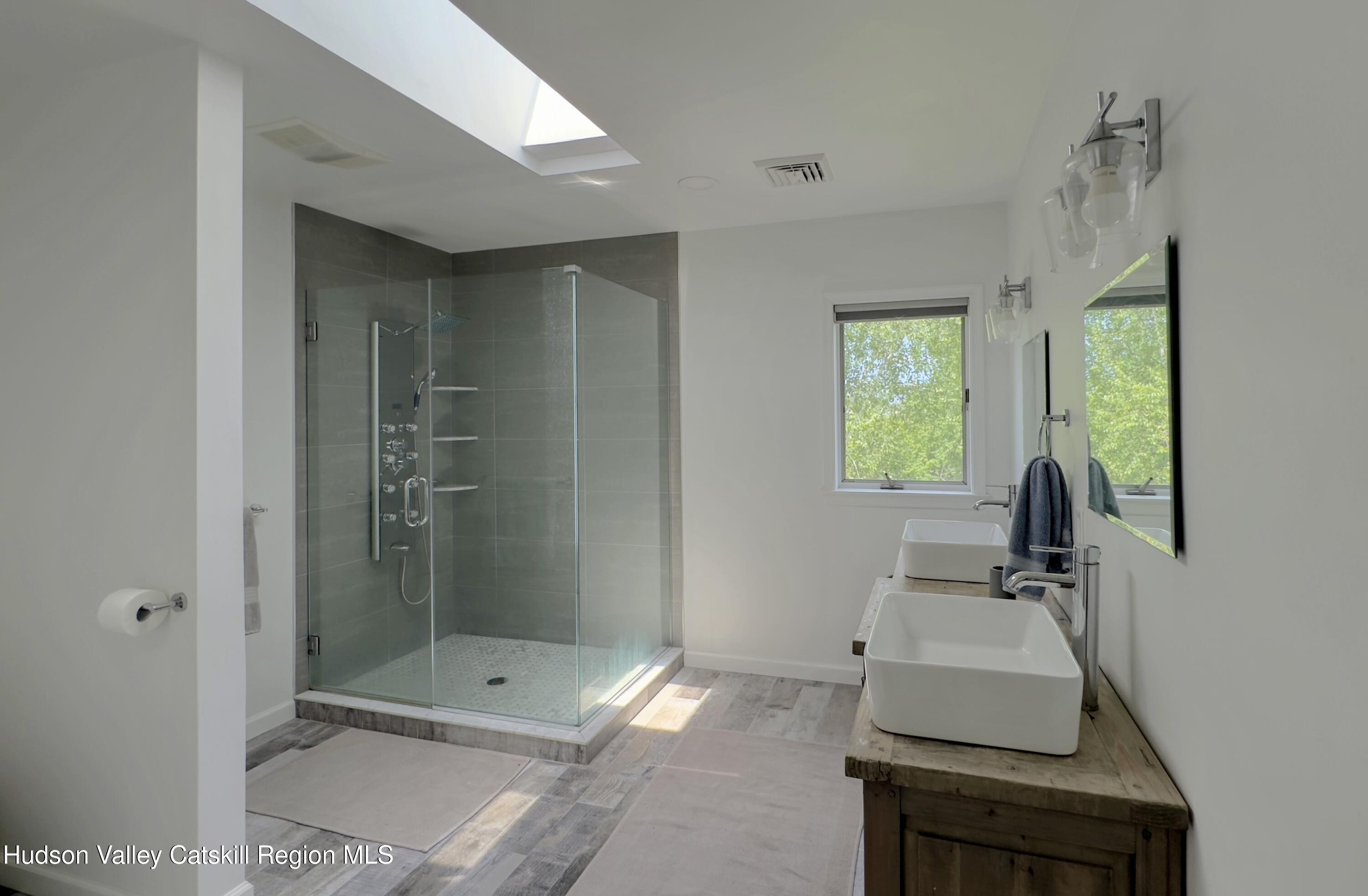 3223 Sleepy Hollow Road Athens, NY 12015 - Photo 26 of 73 a bathroom with a sink toilet and shower