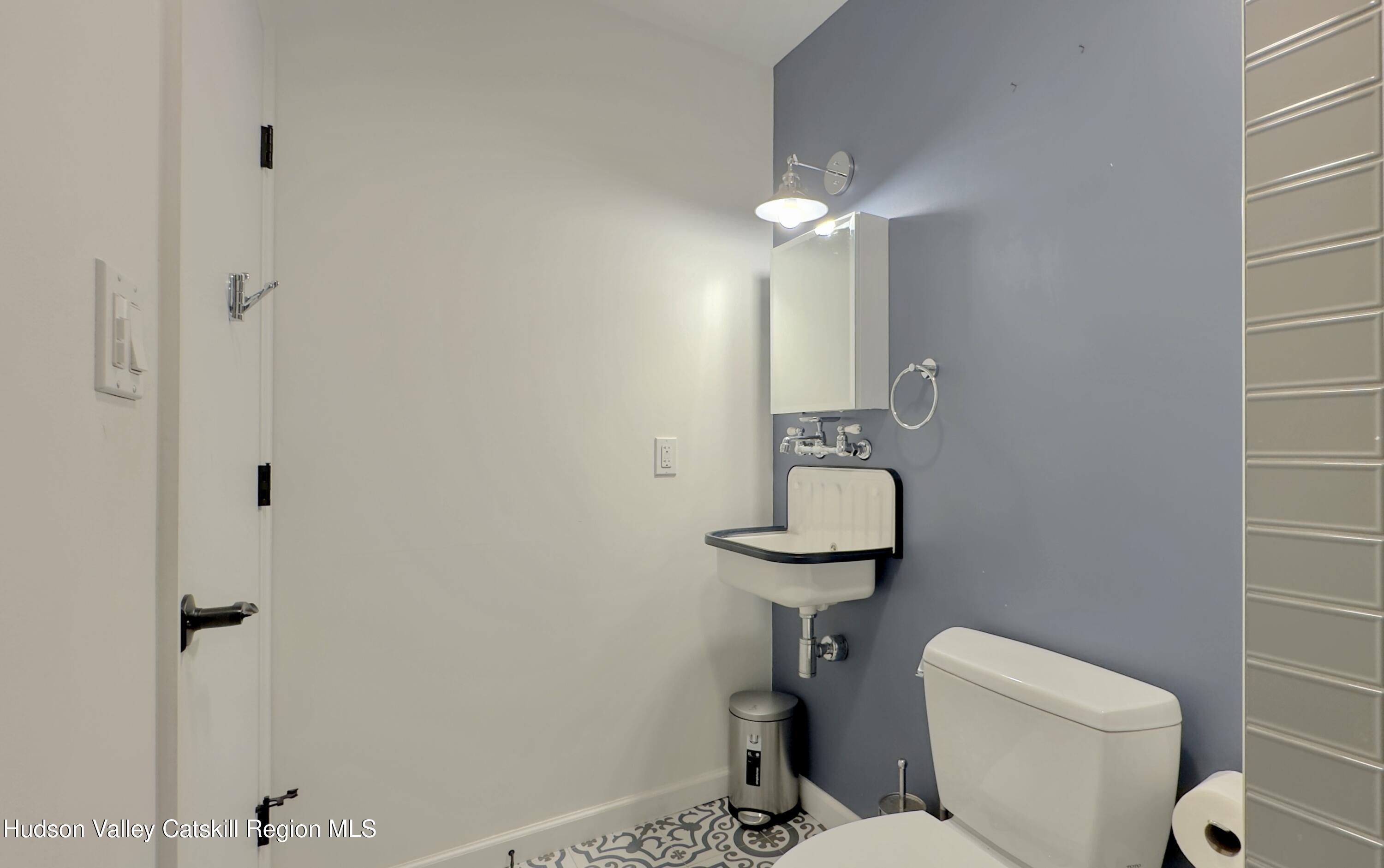 3223 Sleepy Hollow Road Athens, NY 12015 - Photo 37 of 73 a bathroom with a toilet sink and shower