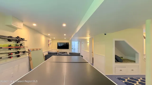 an aerial view of a house with a yard and parking space