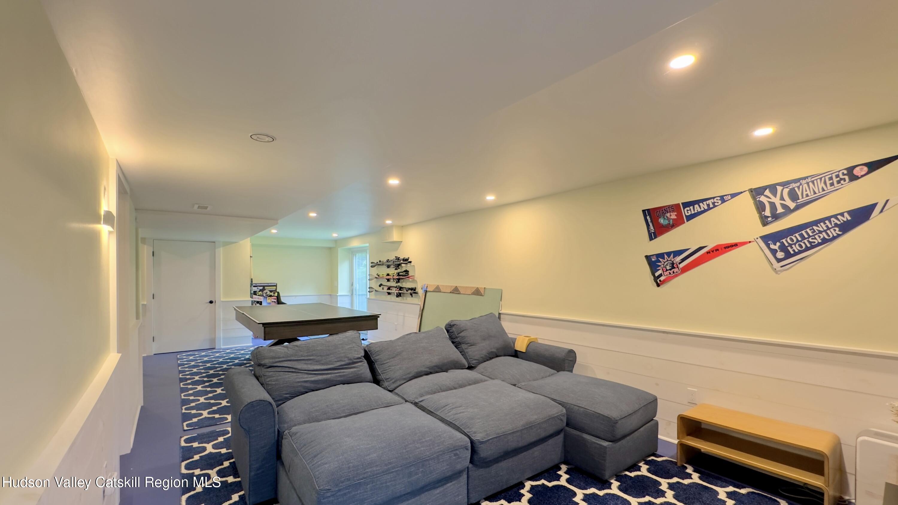 3223 Sleepy Hollow Road Athens, NY 12015 - Photo 45 of 73 a living room with furniture and a chandelier