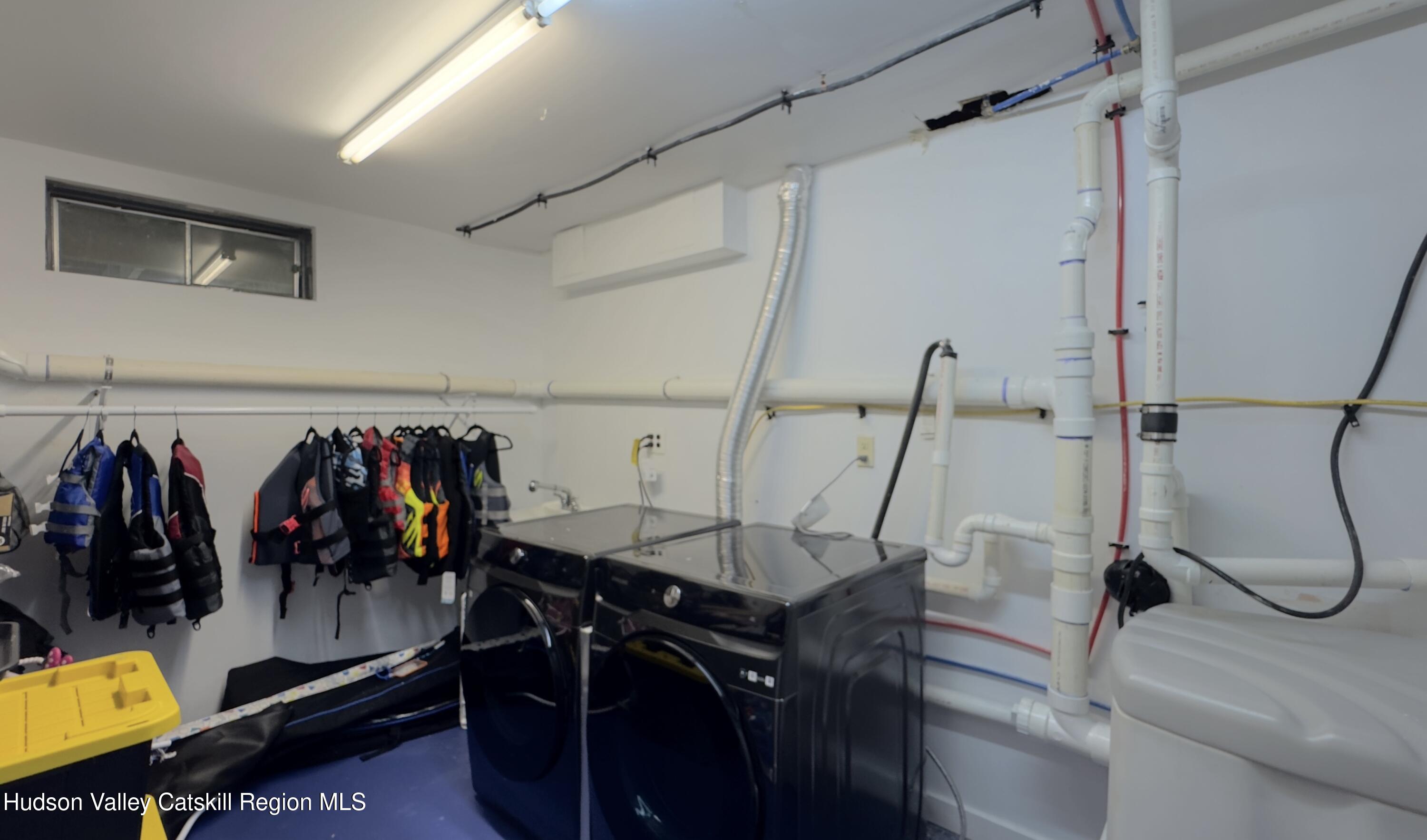 3223 Sleepy Hollow Road Athens, NY 12015 - Photo 46 of 73 a view of walk in closet with clothes and shoes