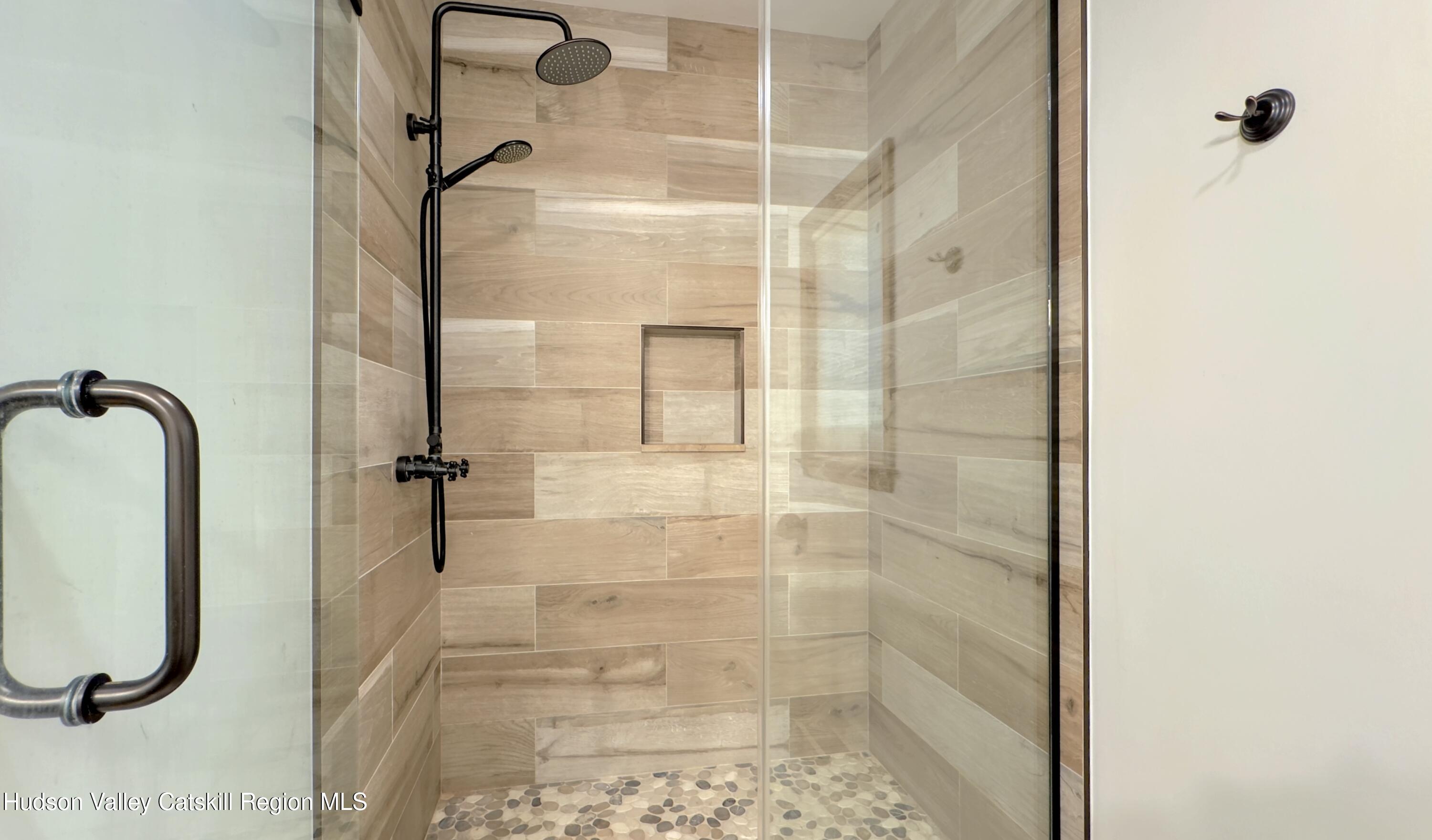 3223 Sleepy Hollow Road Athens, NY 12015 - Photo 49 of 73 a bathroom with a glass shower door