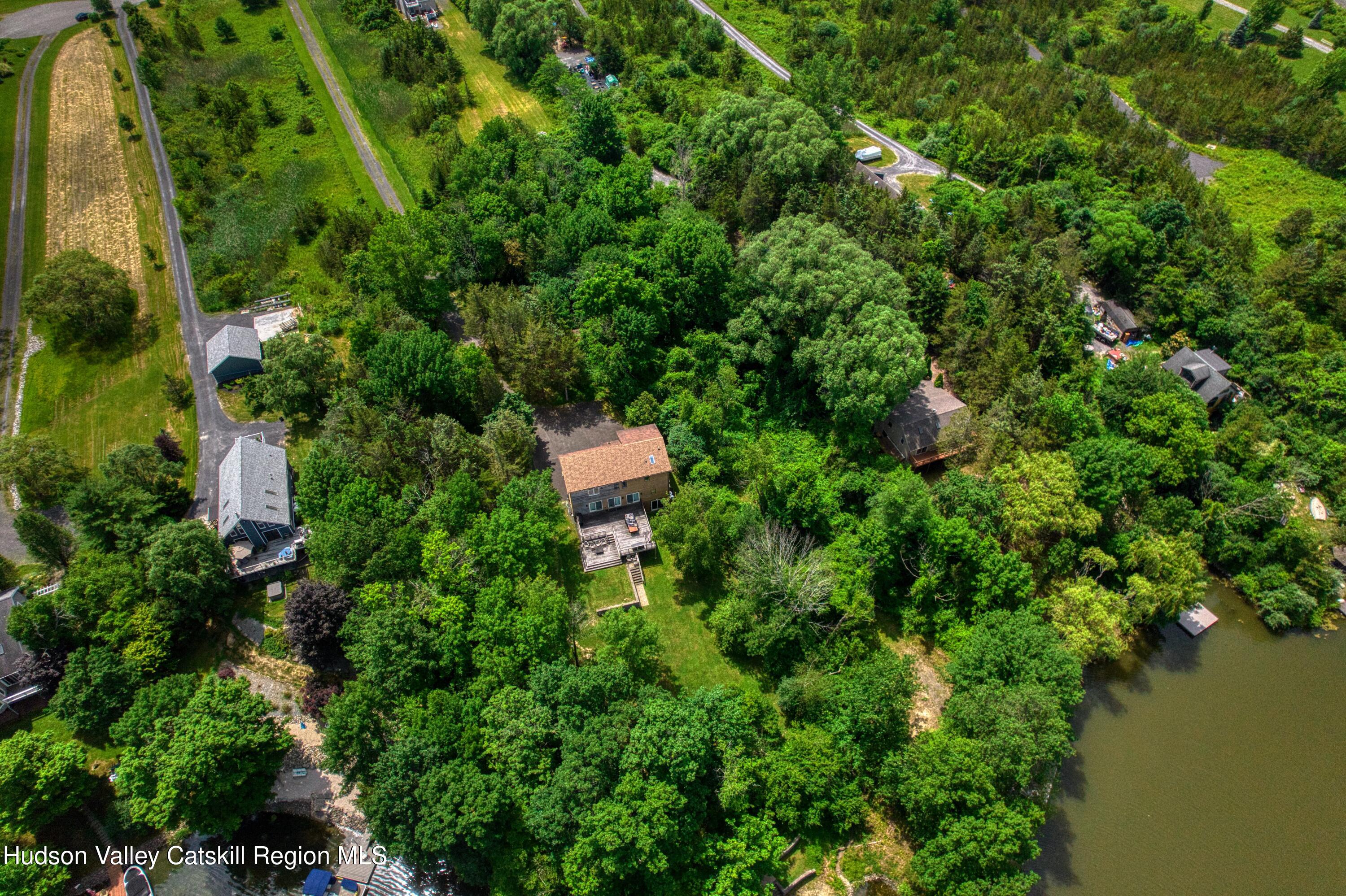 3223 Sleepy Hollow Road Athens, NY 12015 - Photo 62 of 73 an aerial view of a house with outdoor space and trees all around
