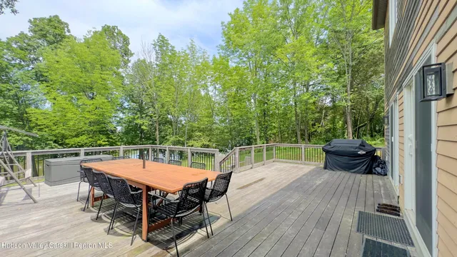 a kitchen with stainless steel appliances a refrigerator sink and white cabinets