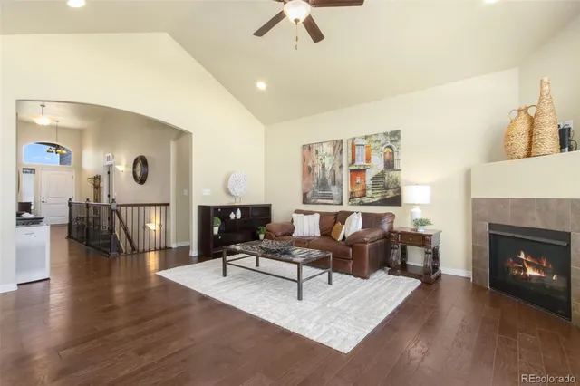 a living room with furniture or wooden floor and a fireplace