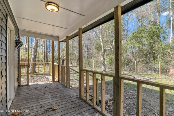 a view of a backyard with trees