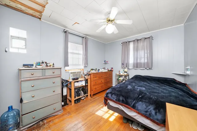 a bed room with a bed and a window