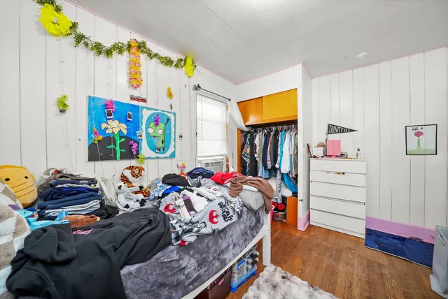 a bedroom with bed and a couch