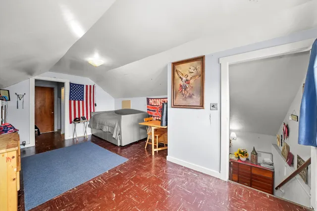 a bedroom with furniture and a walk in closet