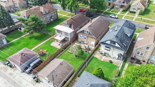 an aerial view of a house with a garden