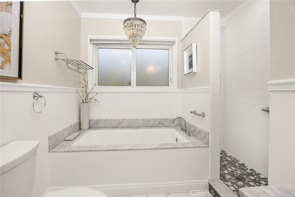 378 Patterson Drive Monrovia, CA 91016 - Photo 17 of 42 a bathroom with a granite countertop bathtub and a shower