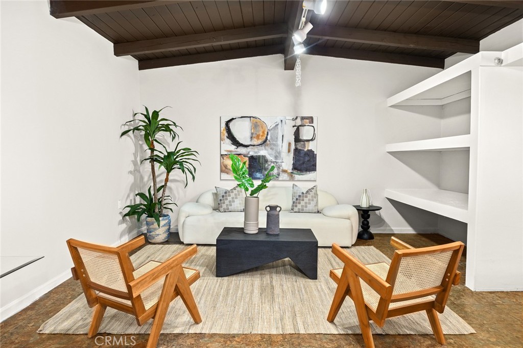 378 Patterson Drive Monrovia, CA 91016 - Photo 27 of 42 a living room with a table and a potted plant