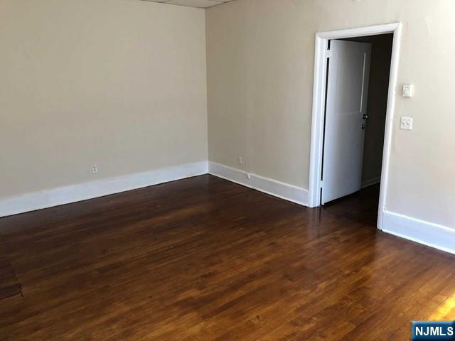 82 Park Avenue, Unit 1 Rutherford, NJ 07070 - Photo 4 of 6 a view of a small space with wooden floor and a sink