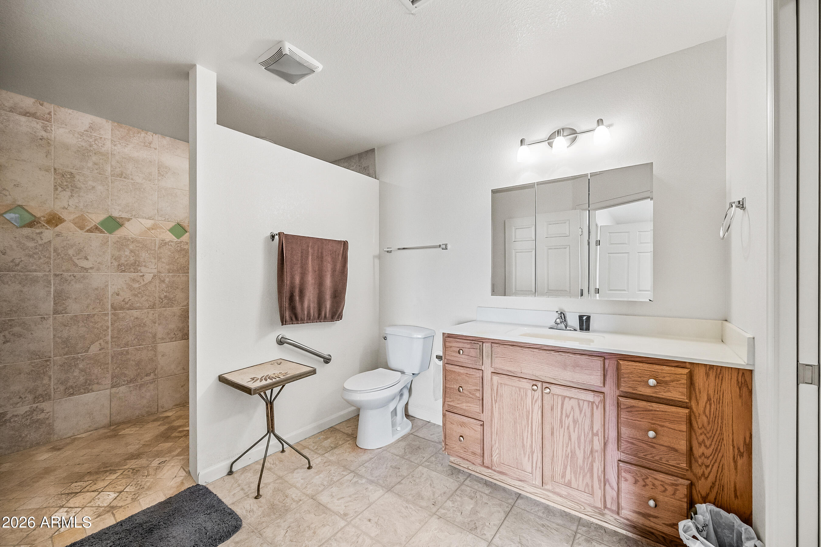 1108 West Mission Lane Phoenix, AZ 85021 - Photo 13 of 30 a bathroom with a toilet sink a mirror and vanity