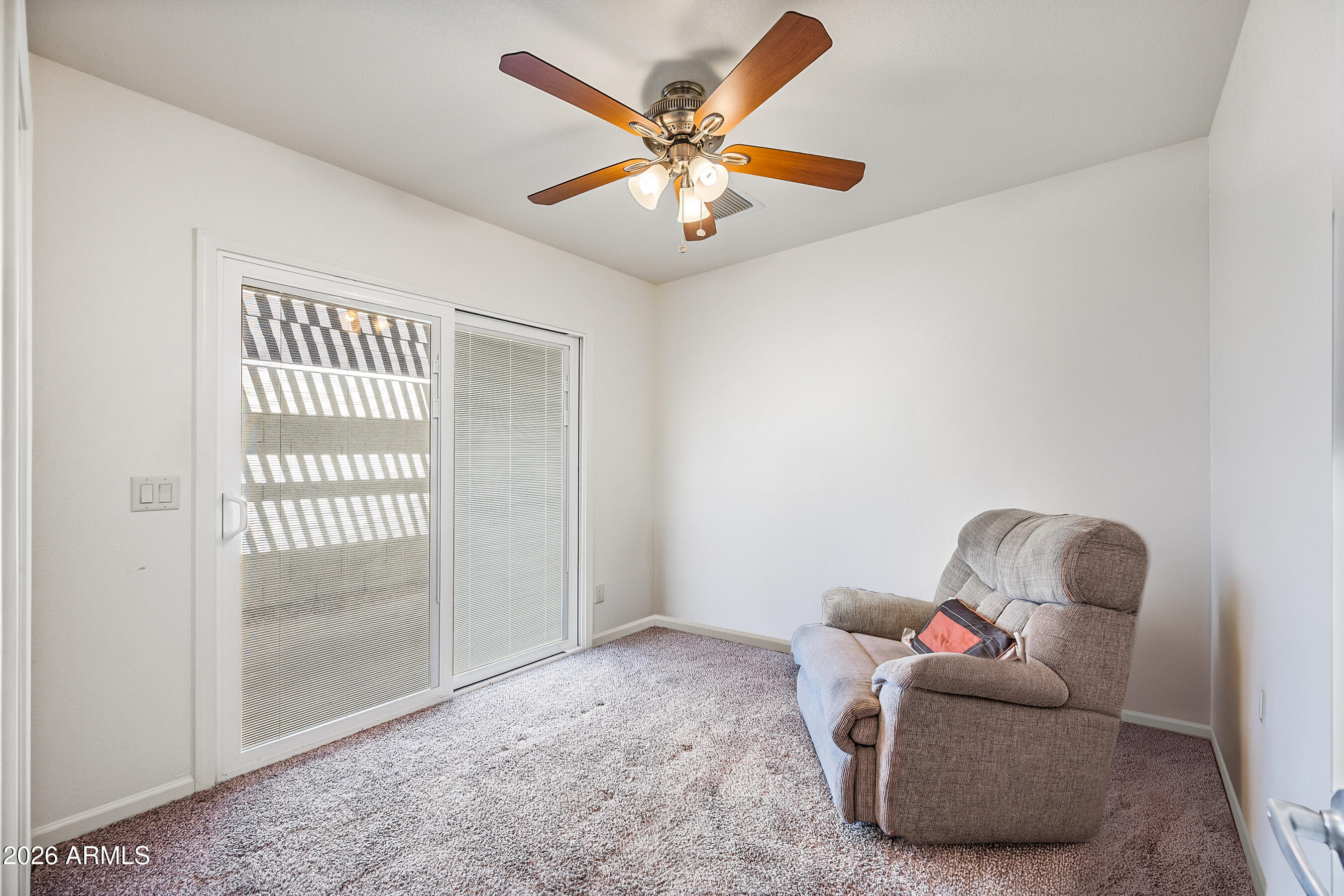 1108 West Mission Lane Phoenix, AZ 85021 - Photo 18 of 30 a room with furniture and a ceiling fan