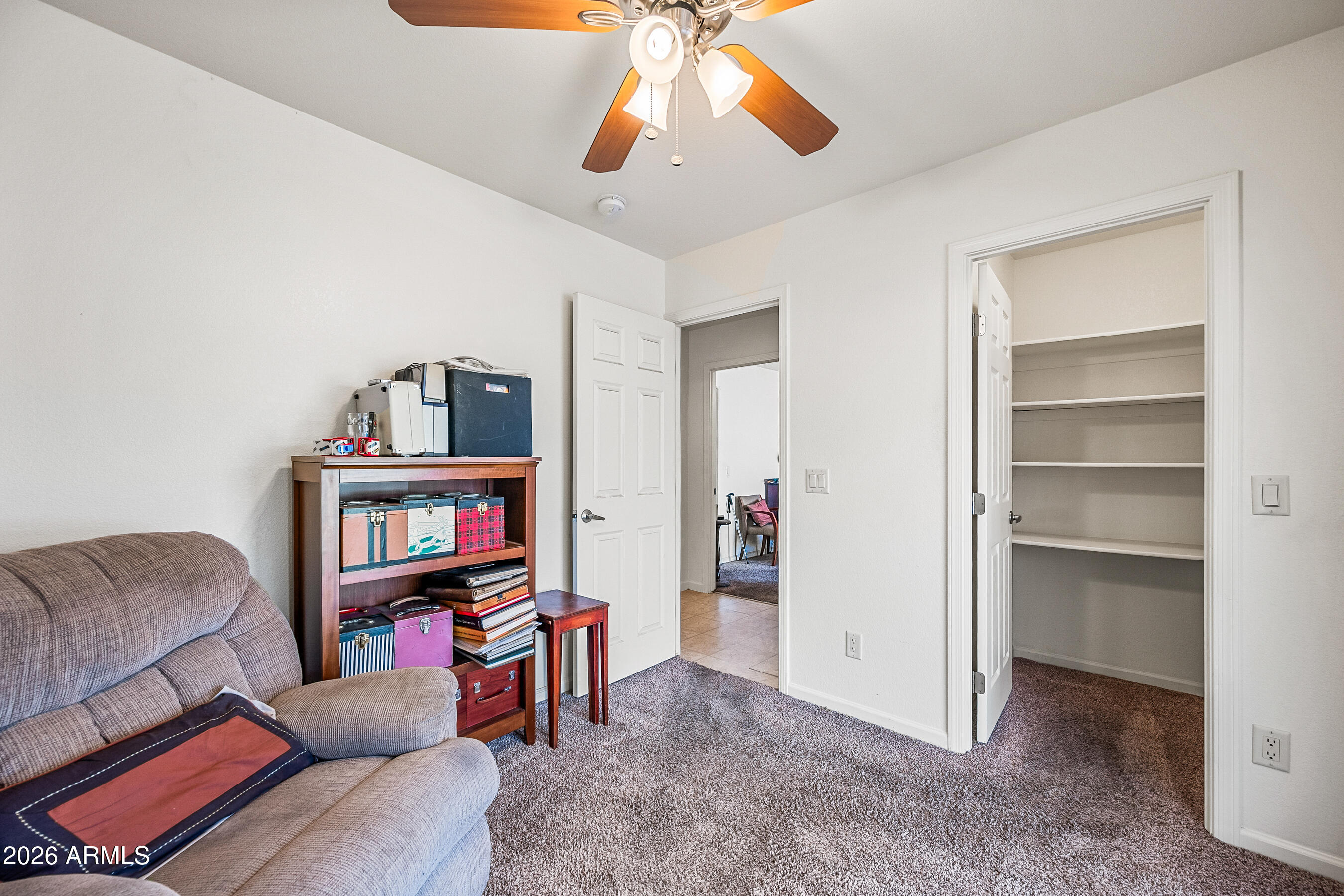 1108 West Mission Lane Phoenix, AZ 85021 - Photo 19 of 30 a living room with furniture and a book shelf
