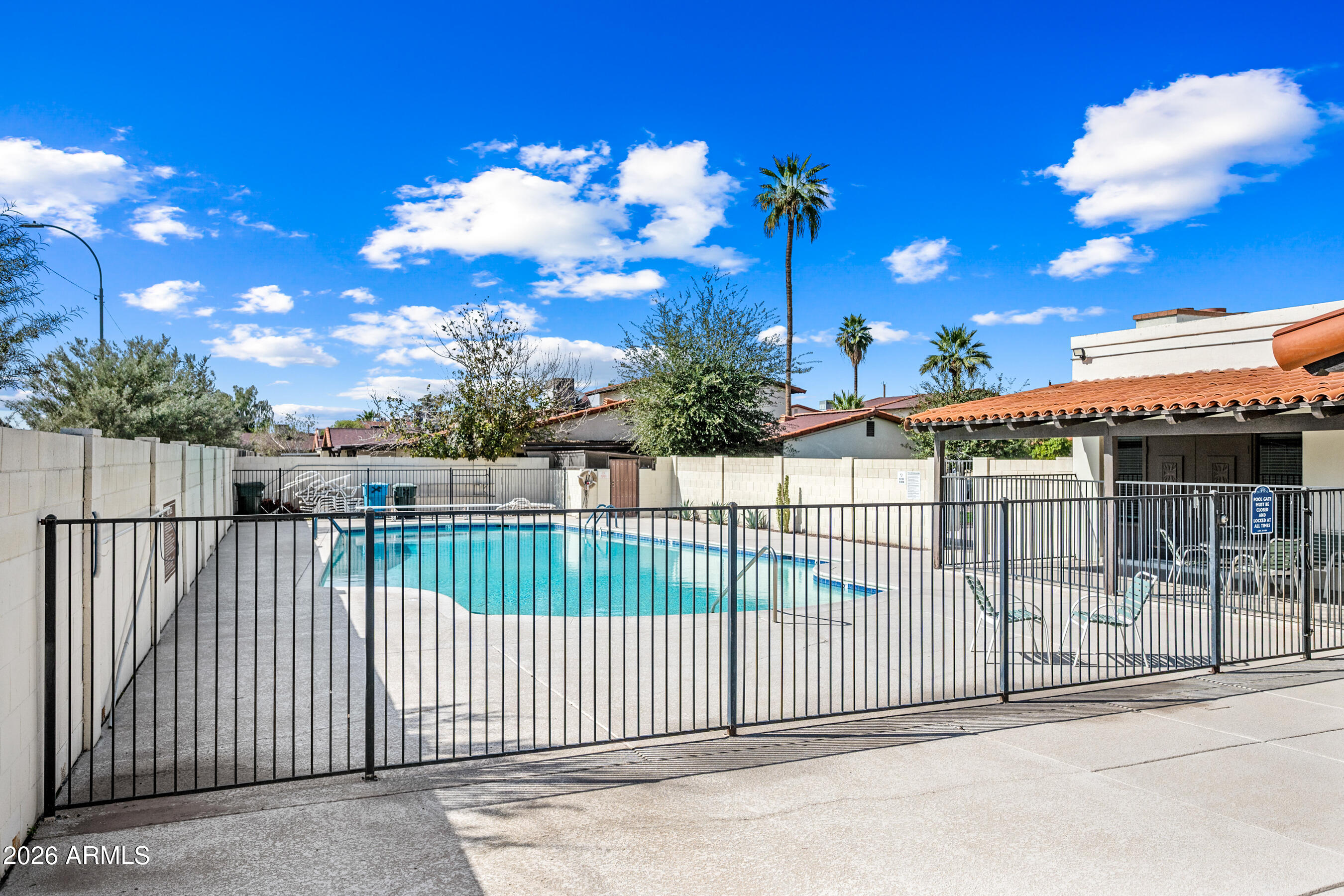 1108 West Mission Lane Phoenix, AZ 85021 - Photo 29 of 30 a view of a house with a wooden fence