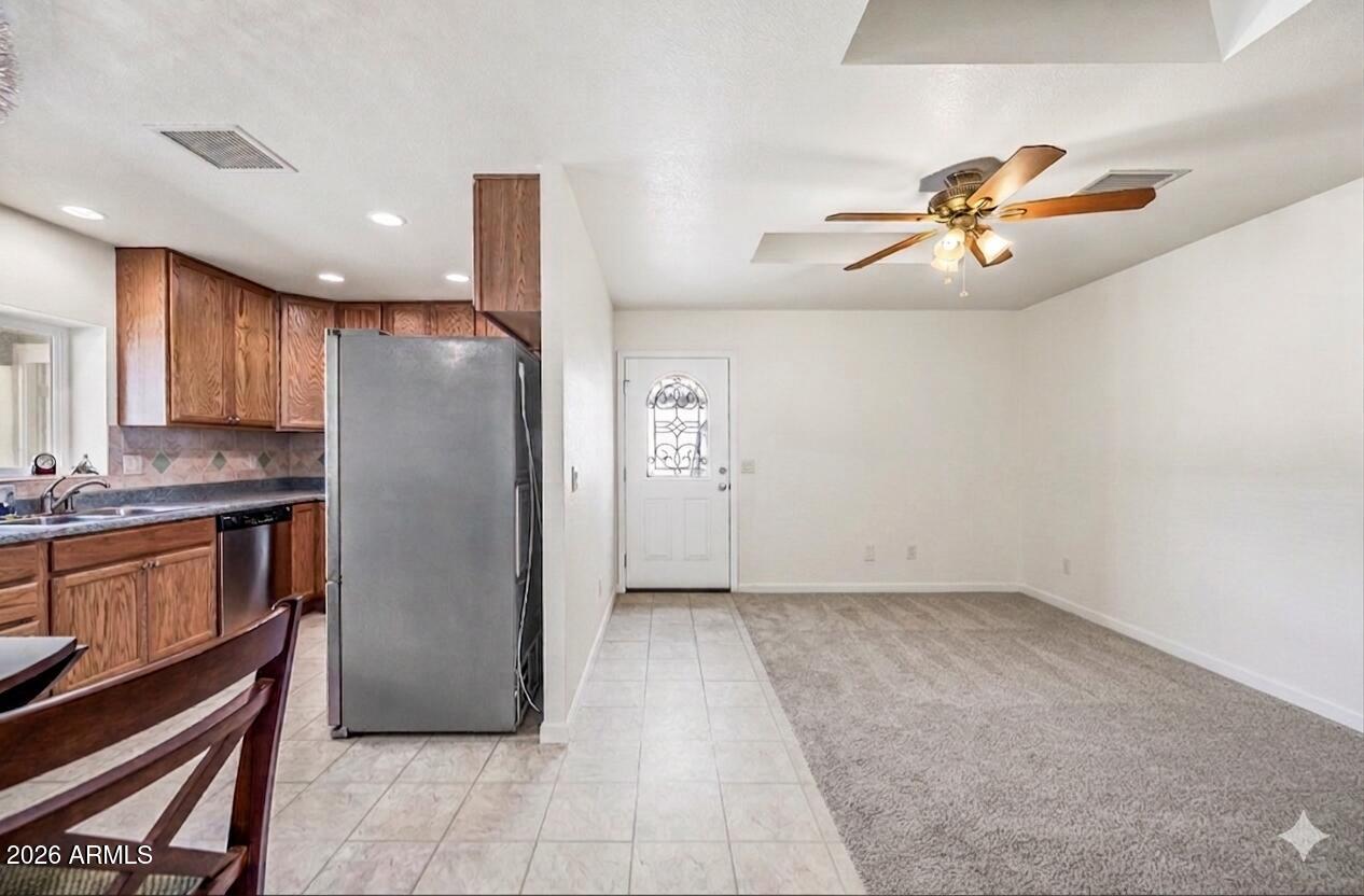 1108 West Mission Lane Phoenix, AZ 85021 - Photo 4 of 30 a kitchen with stainless steel appliances granite countertop a refrigerator and a sink