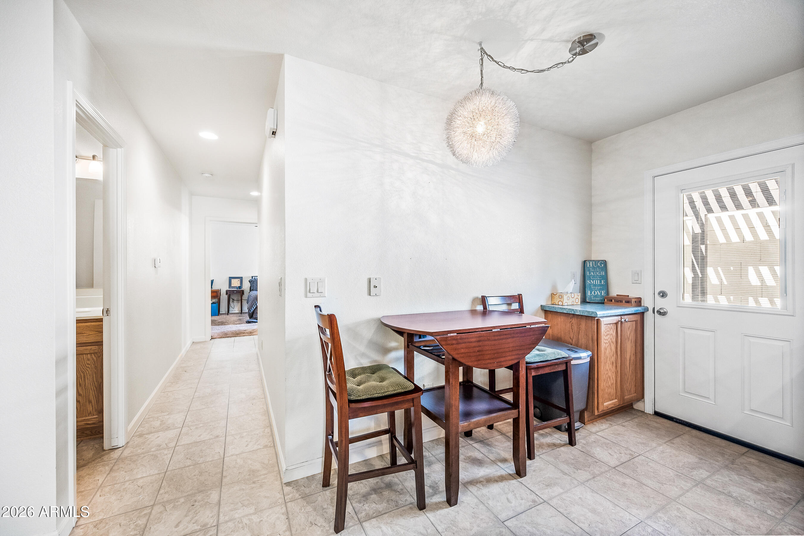 1108 West Mission Lane Phoenix, AZ 85021 - Photo 5 of 30 a view of a dining room with furniture and window